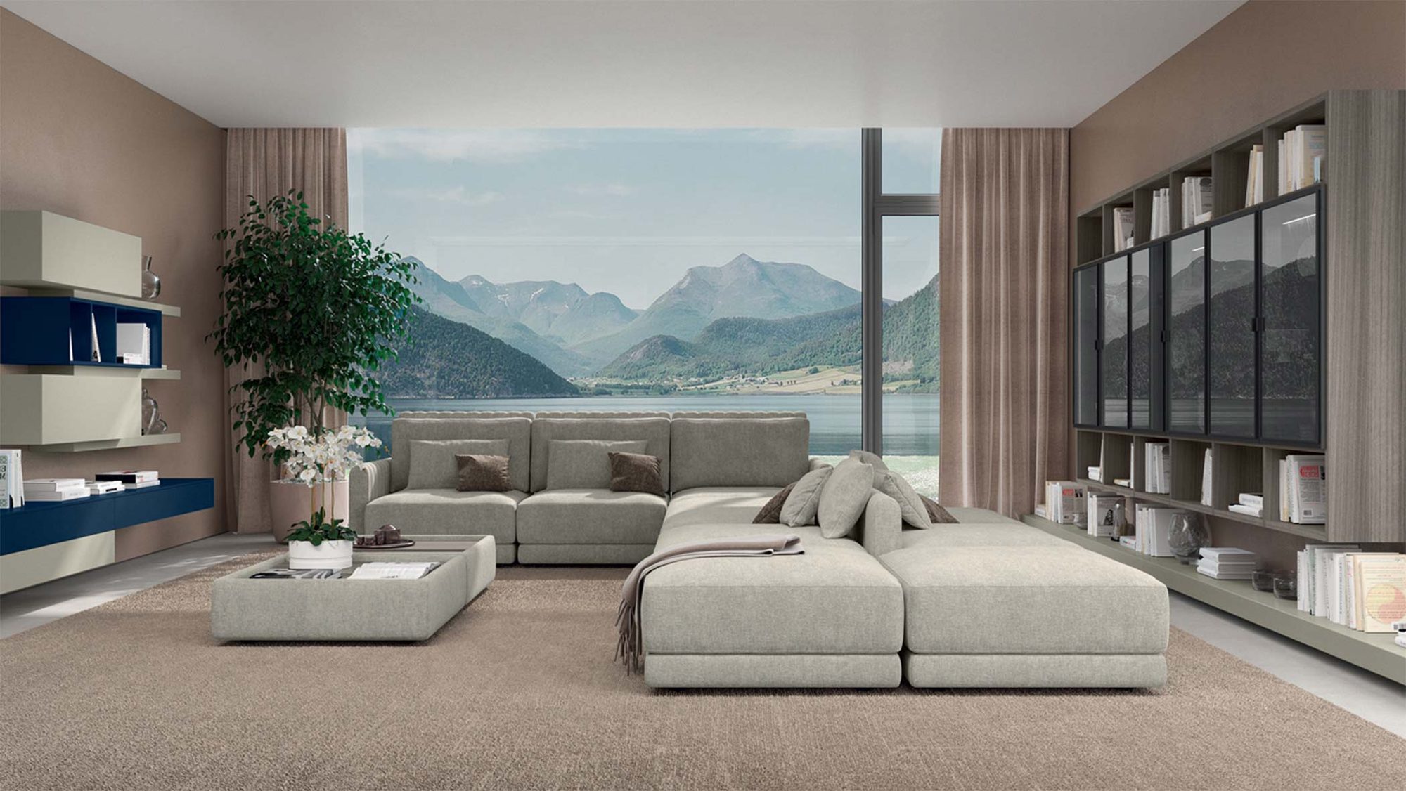 Modular grey sofa and ottomans in a living room with a floor-to-ceiling view of a lake and mountains