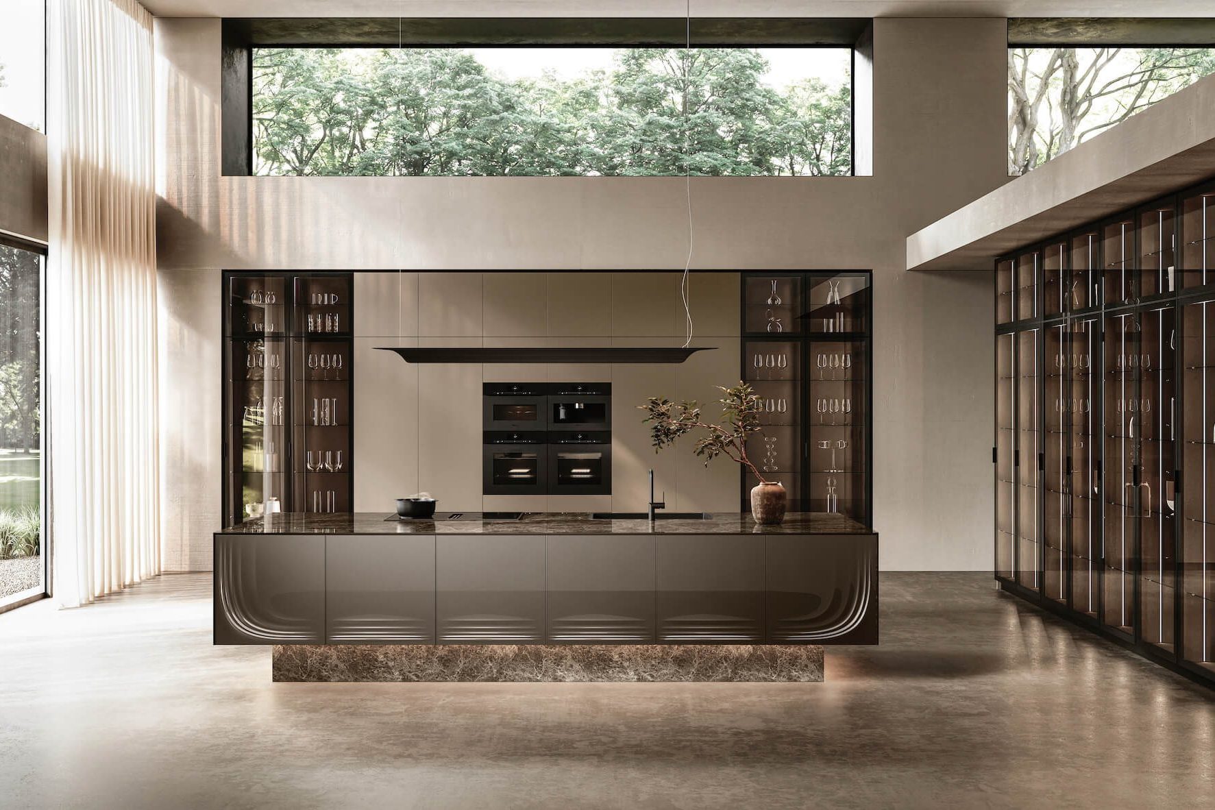 Kitchen with a sculptural curved island, tall glass-fronted cabinets and a clerestory window